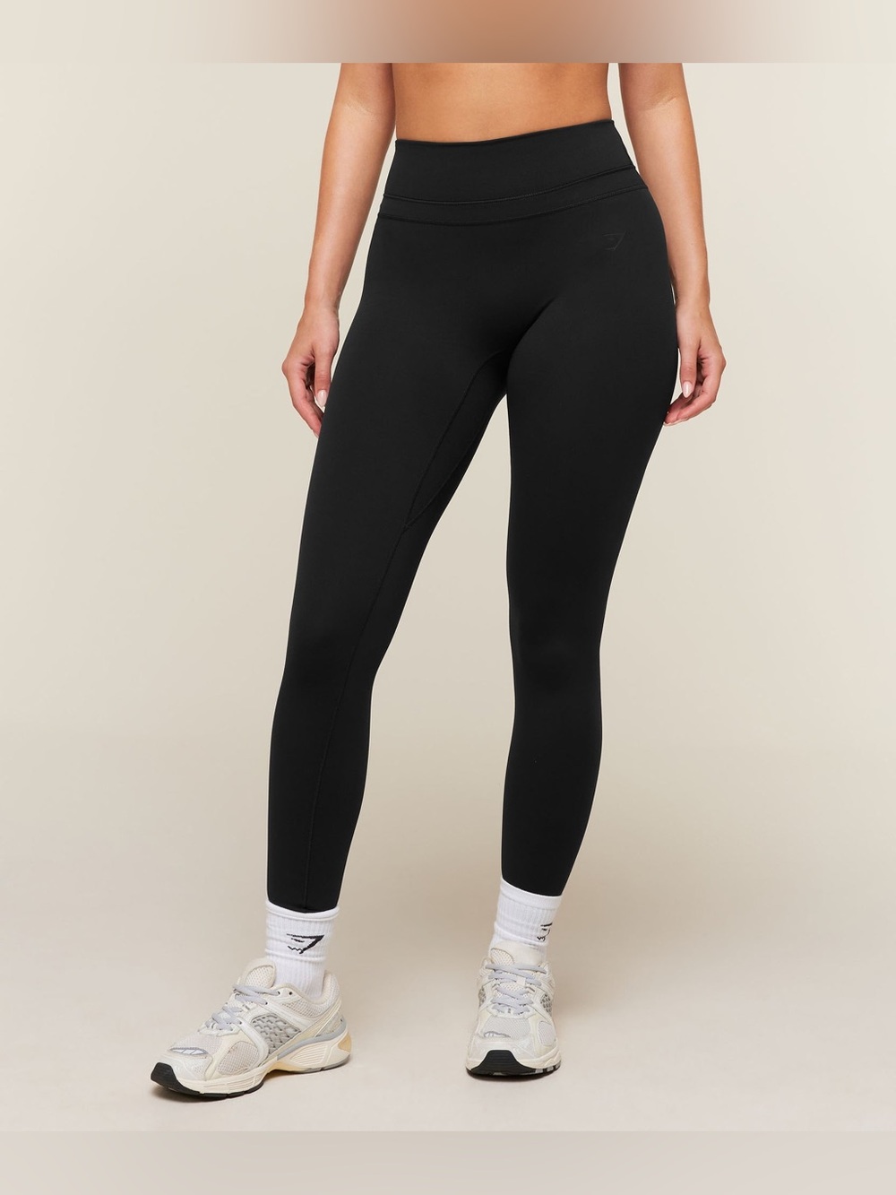 Gymshark black high-waisted butt scrunch leggings.